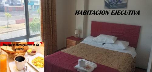 a hotel room with a bed and a window at HOTEL AREQUIPA ANDINOS in Arequipa