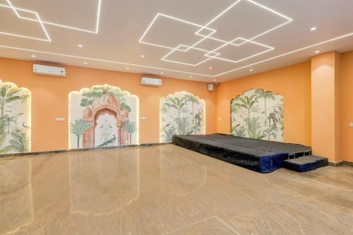 a large room with a bed in the middle of it at Collection O Lorven Grand in Visakhapatnam