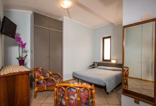 Postel nebo postele na pokoji v ubytování Cavallo Bianco