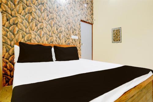 Hotel O MI GUEST HOUSEにあるベッド