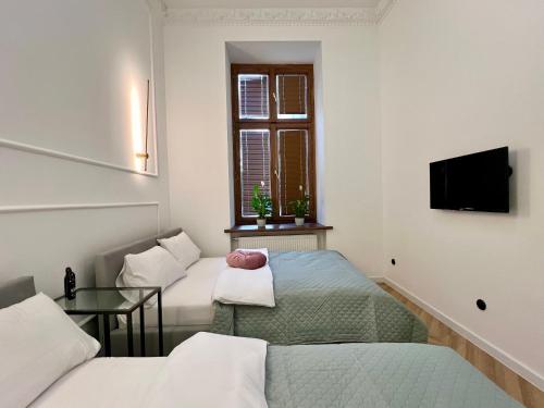 Μια τηλεόραση ή/και κέντρο ψυχαγωγίας στο Stacja Łódź Piotrkowska 82 Apartament No3