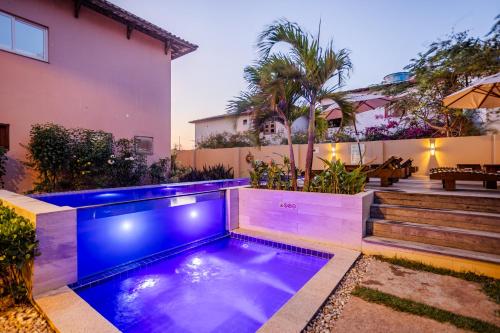 a swimming pool in the backyard of a house at Villa das Palmeiras Jeri in Jericoacoara