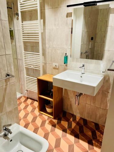 a bathroom with a sink and a toilet at Casale Magrini Affittacamere in Fiamenga