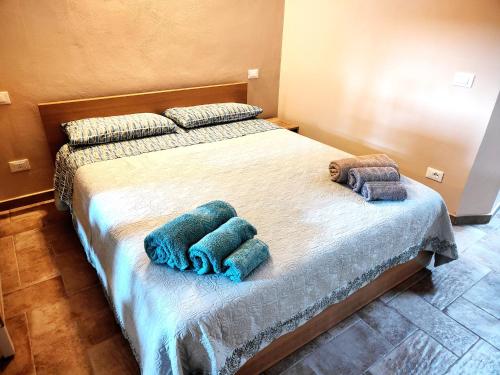 a bedroom with a bed with two towels on it at Paloma13 in Ferrara