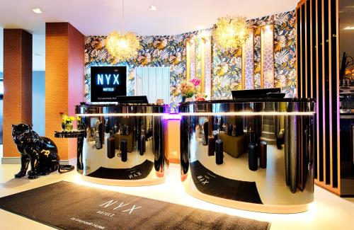 a room with two bottles of wine on display at NYX Hotel Mannheim by Leonardo Hotels in Mannheim