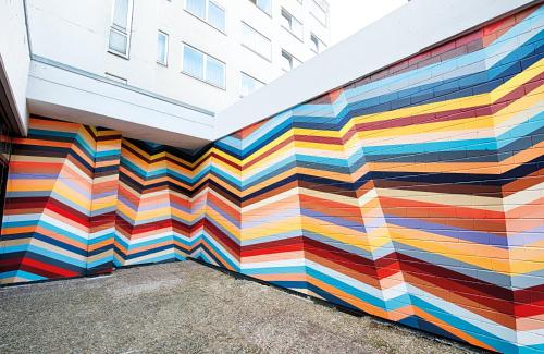 a mural painted on the side of a building at NYX Hotel Mannheim by Leonardo Hotels in Mannheim