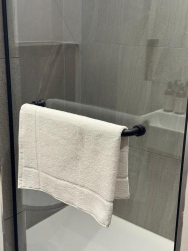 a towel hanging on a towel rack in a bathroom at 1128 Executive Studio, The Capital Triology in Pretoria