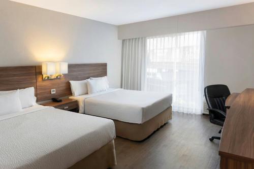 Courtyard by Marriott Puebla Las Animasにあるベッド