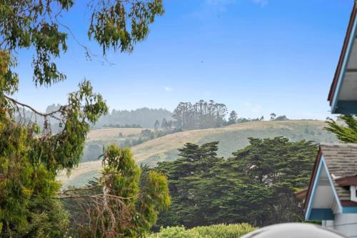 a view of a hill from a house at Montara Penthouse Elevated Comfort Above Downtown Half Moon Bay in Half Moon Bay