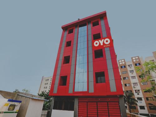 a red building with a novo sign on it at Super Collection O Aryan hotel in Bhubaneshwar