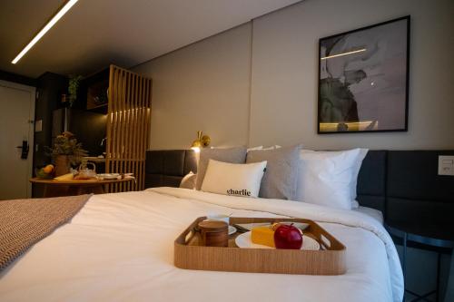 Ένα ή περισσότερα κρεβάτια σε δωμάτιο στο Charlie Legacy Campo Belo