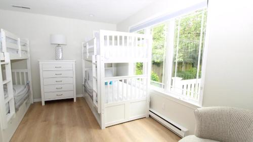 Postel nebo postele na pokoji v ubytování The Beach House At Cape May Ave