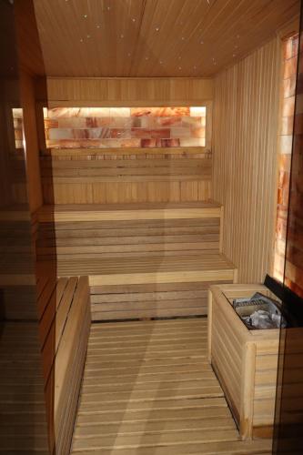 a sauna with wooden flooring and a wooden at Apartman TAUNUS in Kopaonik