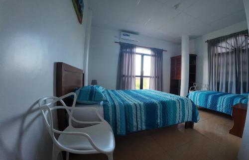 Postel nebo postele na pokoji v ubytování Hostal Neptuno - Poseidon