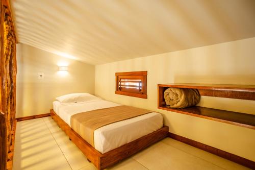 a bedroom with a large bed in a room at Villa das Palmeiras Jeri in Jericoacoara