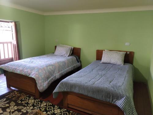 Katil atau katil-katil dalam bilik di Casita en Urubamba