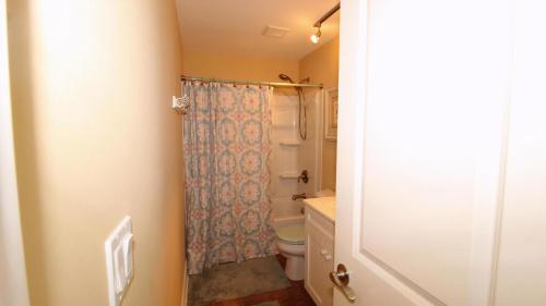 a bathroom with a toilet and a shower at 1136 And 1138 Lafayette Street Condo in Cape May