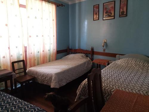 Ένα ή περισσότερα κρεβάτια σε δωμάτιο στο Hostal Residencial Avenida