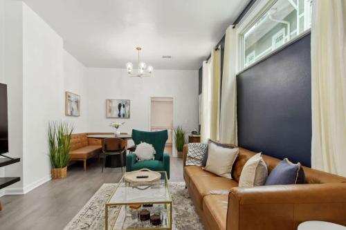 a living room with a couch and a table at Charming Canal Street Family Retreat in Heart of NOLA in New Orleans