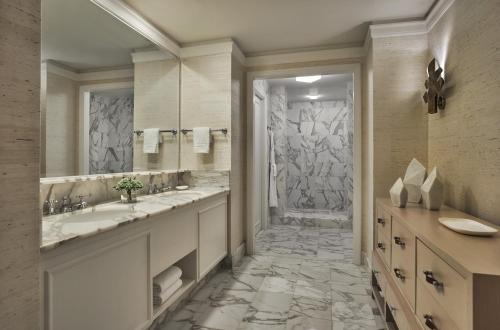 a bathroom with a sink and a shower at Four Seasons Resort Nevis in Nevis