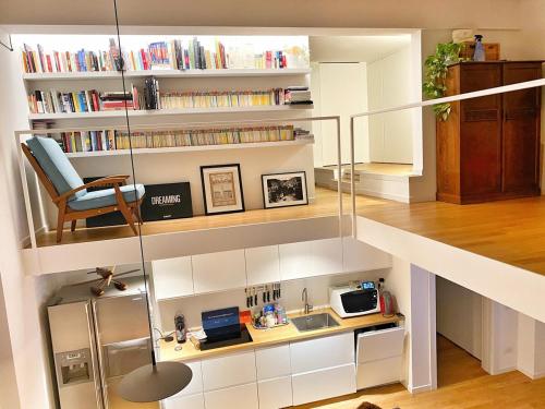 Design loft in the Navigli-Forum area with private parking