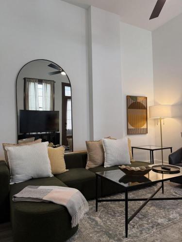 a living room with a couch and a table at Delightful Canal Street Family Home in Mid-City in New Orleans