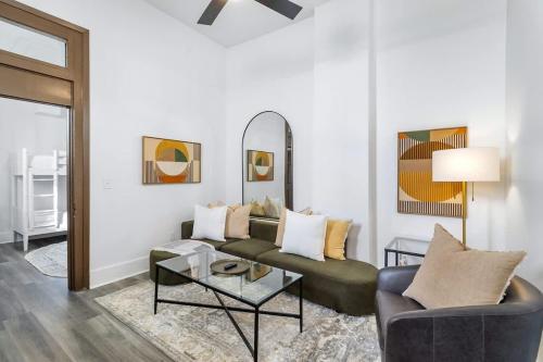 a living room with a couch and a table at Delightful Canal Street Family Home in Mid-City in New Orleans