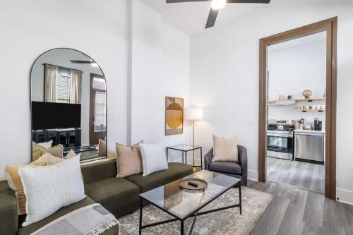 a living room with a couch and a table at Delightful Canal Street Family Home in Mid-City in New Orleans