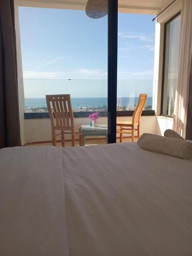 Postel nebo postele na pokoji v ubytování Appartement Michele Vue sur Mer pour les familles