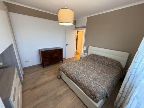 a bedroom with a bed and a dresser in it at Charlie's House in Rome