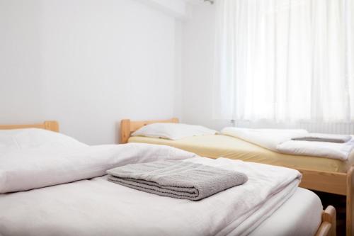 Ένα ή περισσότερα κρεβάτια σε δωμάτιο στο Hodváb Apartmánový Dom