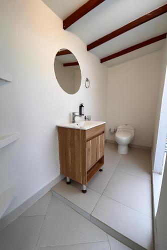 a bathroom with a sink and a toilet at Fragata Island House in Isla Grande