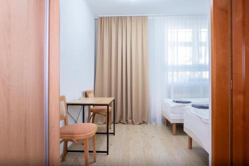 Ένα ή περισσότερα κρεβάτια σε δωμάτιο στο Hodváb Apartmánový Dom