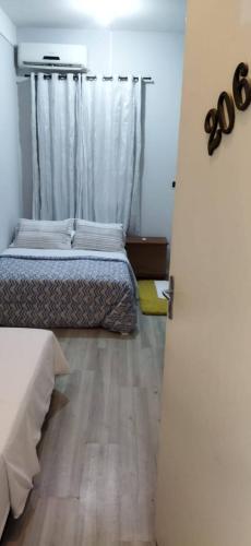 Postel nebo postele na pokoji v ubytování Pousada Villa Dom Carlos