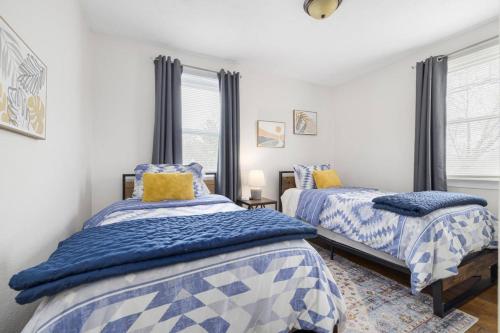 a bedroom with two beds and a window at 3BR Cottage Near Downtown Kingsport in Kingsport