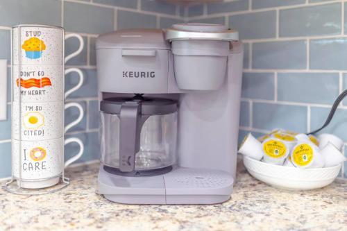 a food processor sitting on a counter next to a blender at 3BR, 1BA House Blocks from ETSU and Downtown in Johnson City
