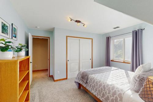 a bedroom with a bed and a window at Logan's Landing in Orick