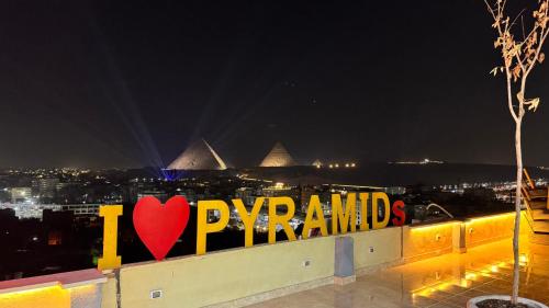 a sign that says i love paris with a heart at ROFY VIP Apartment in Cairo