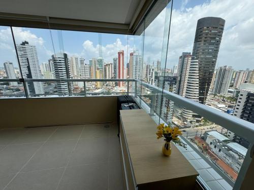 a balcony with a view of a city at Modern Condo Doca in Umarizal in Belém