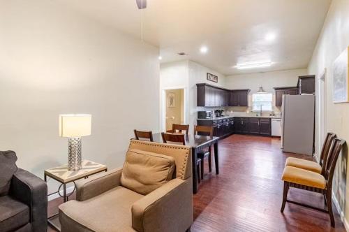 a kitchen and living room with a couch and a table at Private Rooms in San Antonio Home 5 mins to downtown in San Antonio