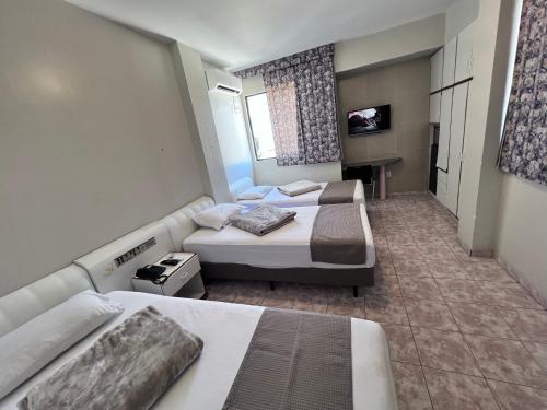 Katil atau katil-katil dalam bilik di Águas Palace Hotel