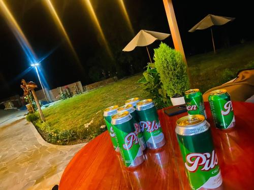 a group of soda cans on a table at night at HOTEL HUAYTARA CasaBlanca in Huaytará