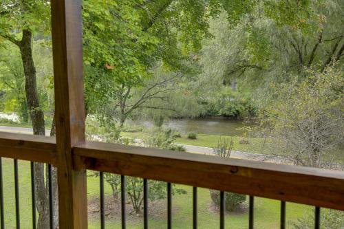 a view of a river from the porch of a cabin at Sylva Riverfront Cabin Near WCU Pet-Friendly! in Sylva