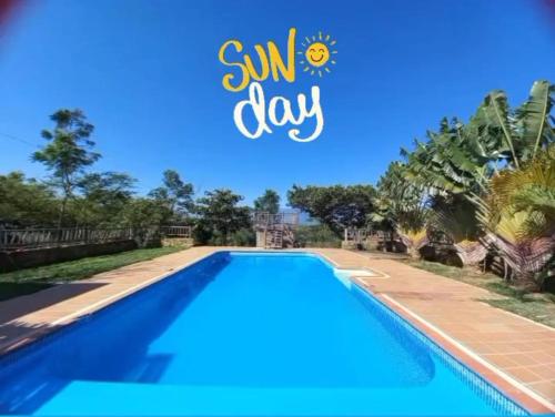 a swimming pool at a villa with a sunny day at San Rafael del Campo - Barichara in Barichara