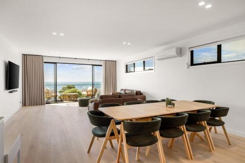 a dining room with a table and chairs at San Remo Luxe 1 in San Remo