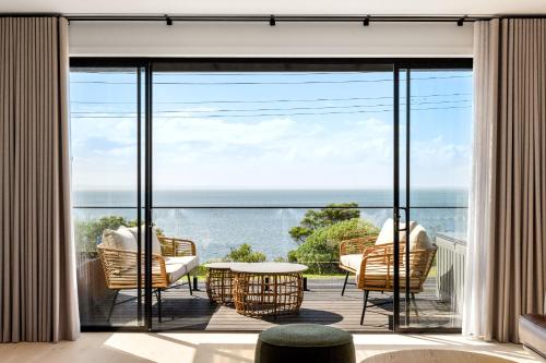 a balcony with a view of the ocean at San Remo Luxe 1 in San Remo