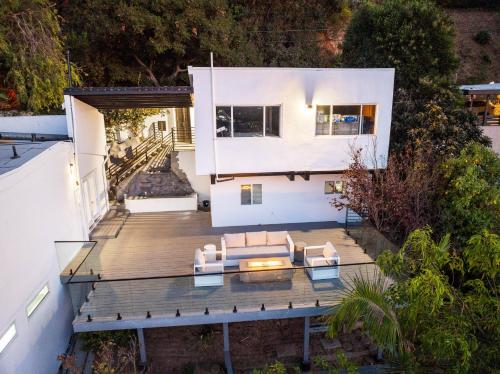 an aerial view of a house with a wooden deck at Hollywood Hills Retreat - Next to Universal Studios in Los Angeles