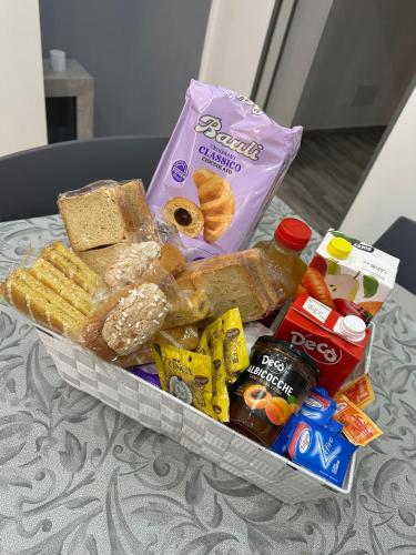 a tray of bread and other snacks on a table at Blue Wave Apartment in Palermo