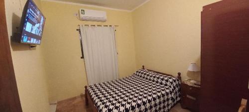 Postel nebo postele na pokoji v ubytování Residencial Doña Pocha