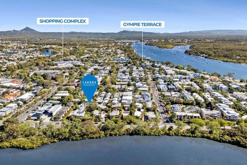 an aerial view of a marina with a city at Peaceful Garden Escape - 2BR Noosaville Getaway in Noosaville